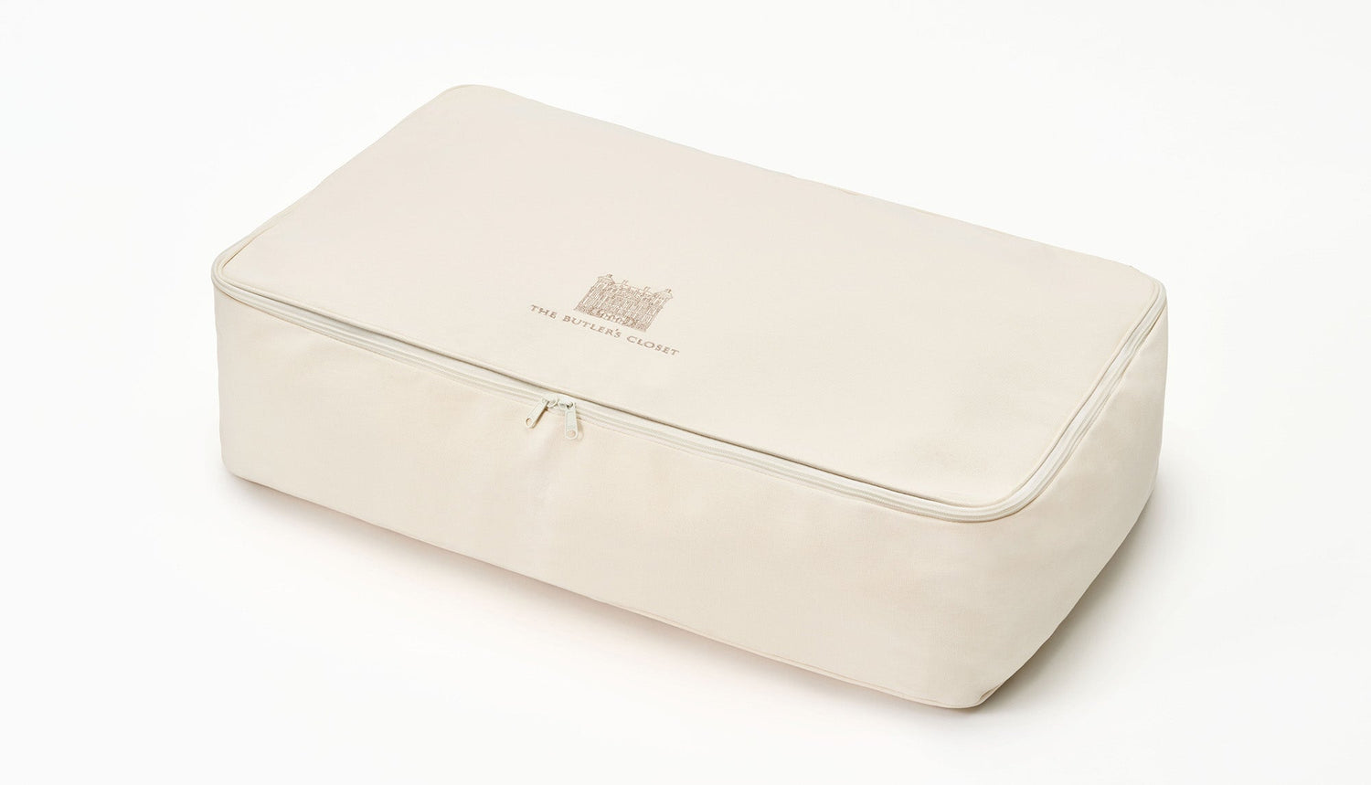 A rectangular beige storage box with a zipper and The Ritz-Carlton logo on top.