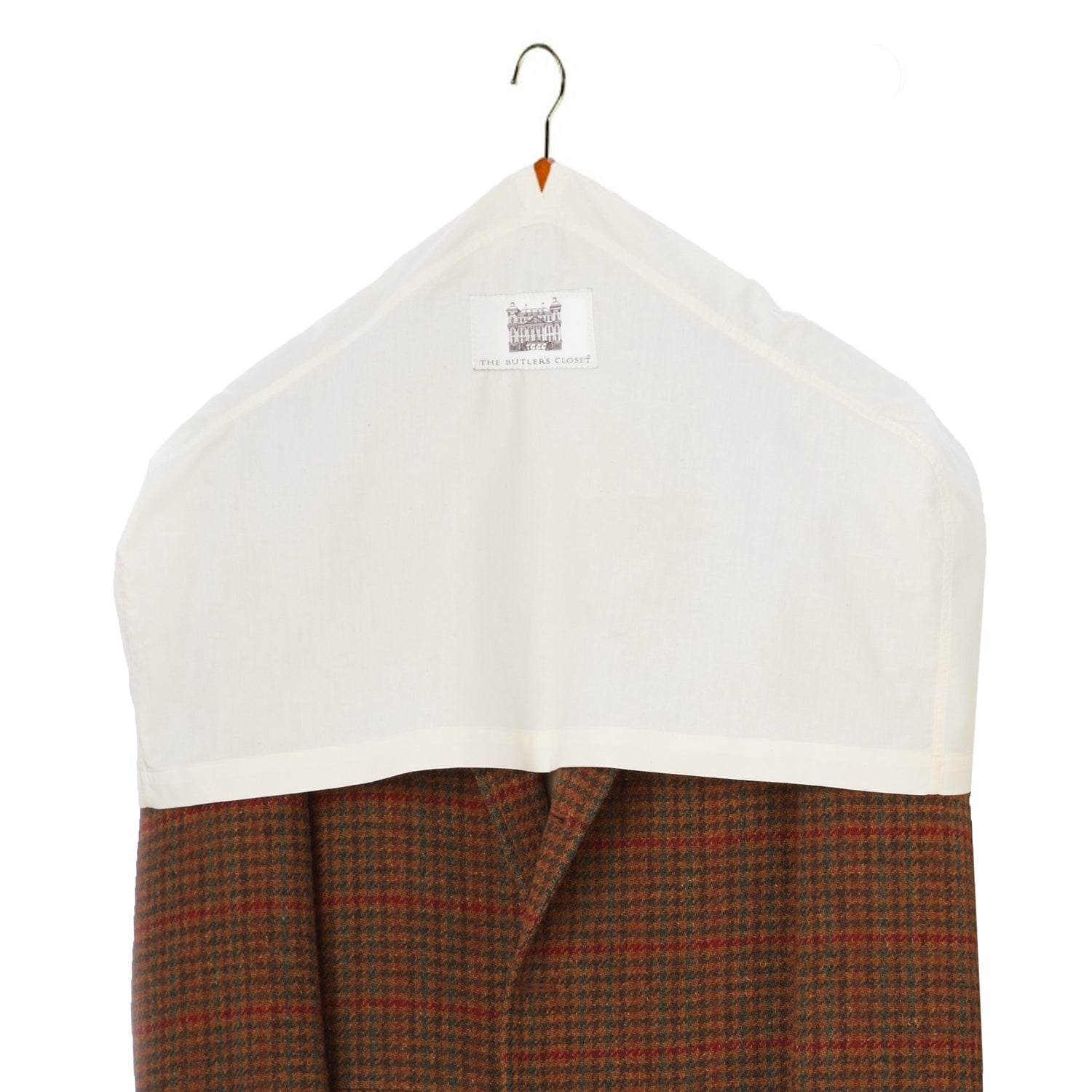 Houndstooth garment covered with a white protective cloth on a hanger.